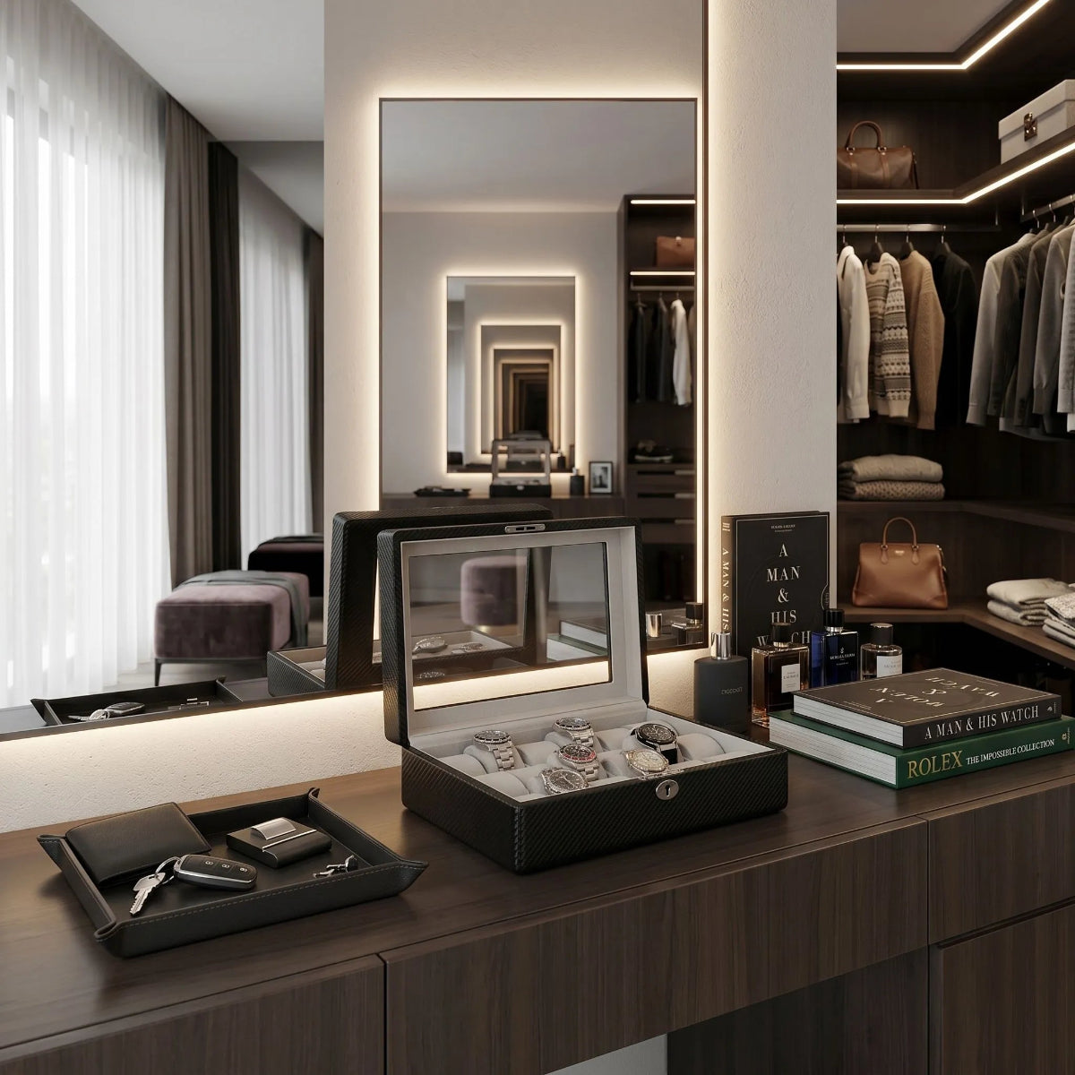 Front view of an 18-watch carbon fibre leather watch box in a bright, modern walk-in dressing room surrounded by elegant accessories.