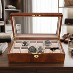 Close-up of 12-watch burl walnut wood box in bright modern dressing room, highlighting craftsmanship and interior compartments.