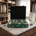 Close-up of green aluminium-look 18-watch briefcase with lock and lift-out tray in a stylish walk-in dressing room.