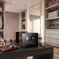 Tempus 2 watch winder with touch screen in a bright, modern dressing room surrounded by horology tools and plush display trays.