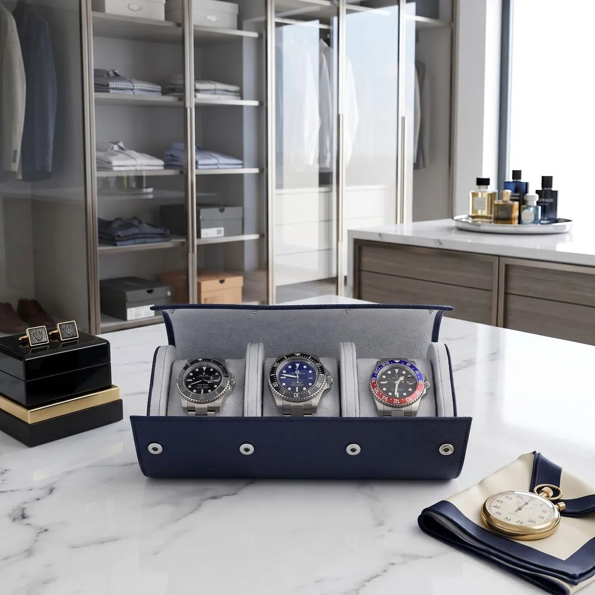 Close-up of navy blue saffiano leather watch roll with soft interior lining and three watch compartments in a bright walk-in dressing room.