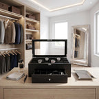 Elegant 22-watch box in black oak veneer with drawer, displayed in a bright, modern dressing room with luxury props.