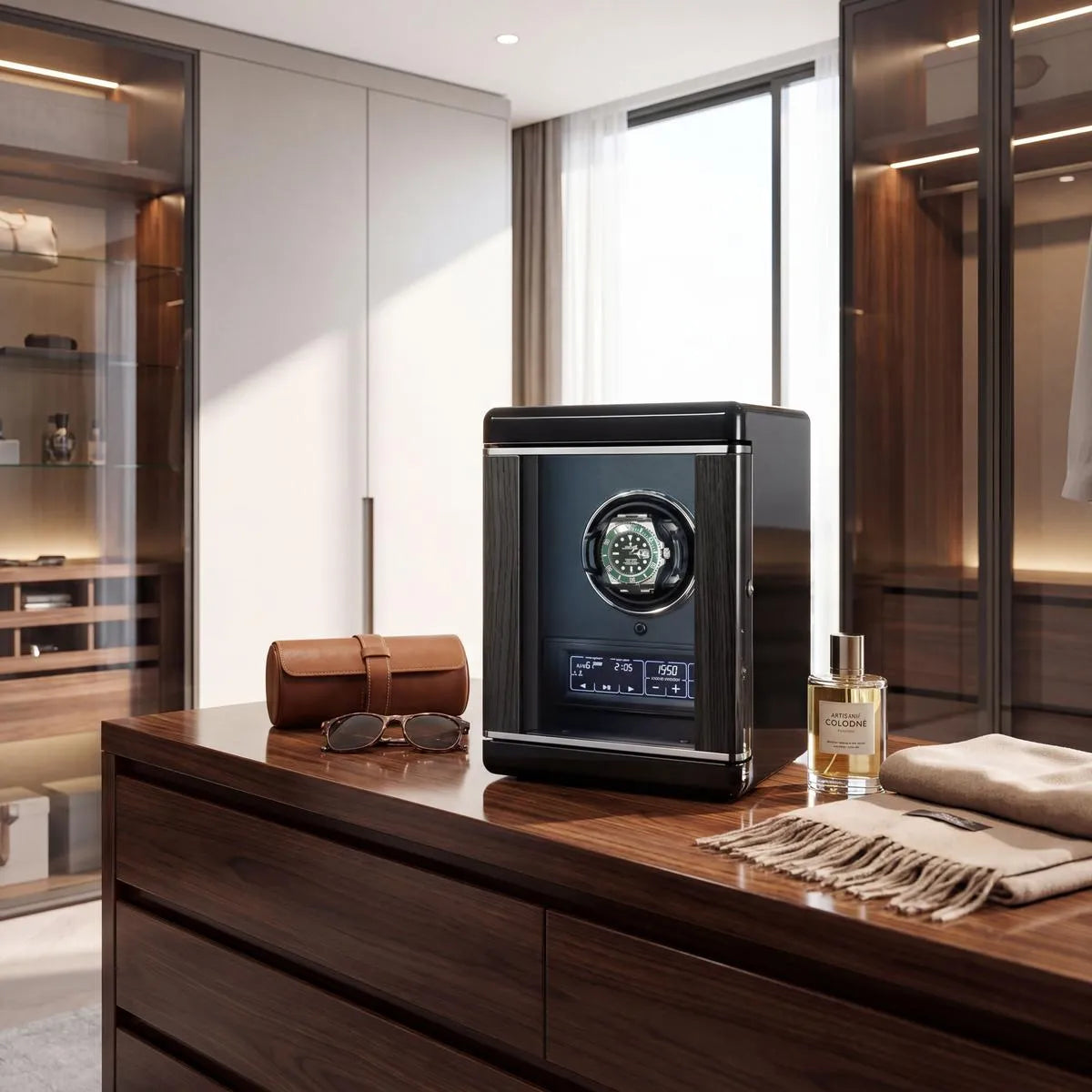 Sleek black watch winder for one automatic watch with remote control, displayed in a luxurious modern dressing room setting with elegant props.