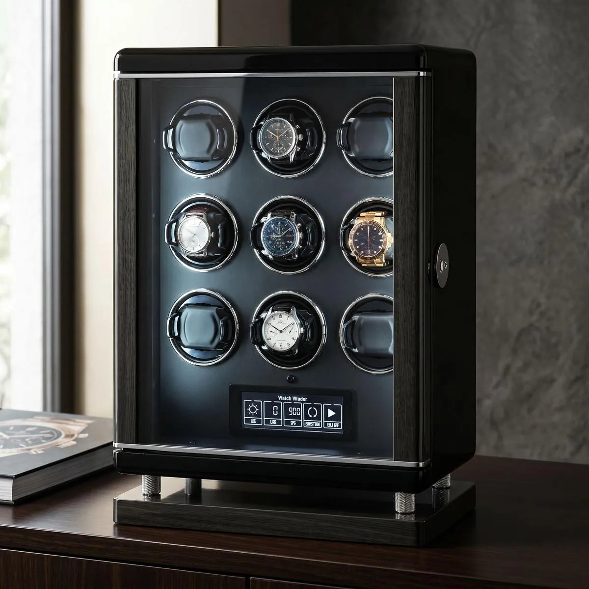 Sleek 9-watch winder for automatic watches with biometric lock, premium finish, digital touchscreen, and LED lighting in a luxury setting.
